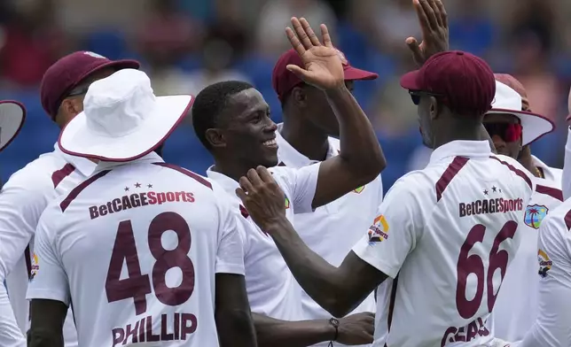 West Indies' Shamar Joseph celebrates taking the wicket of Australia's Travis Head during day one of the second cricket Test match at National Cricket Stadium in St. George's, Grenada, Thursday, July 3, 2025. (AP Photo/Ricardo Mazalan)