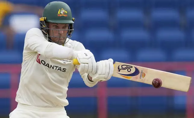 Australia's Alex Carey plays a shot from a delivery of West Indies' Anderson Phillip during day one of the second cricket Test match at National Cricket Stadium in St. George's, Grenada, Thursday, July 3, 2025. (AP Photo/Ricardo Mazalan)