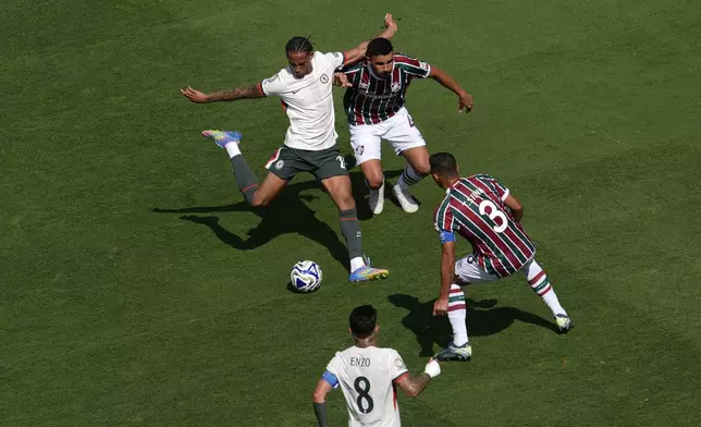 Chelsea's Joao Pedro, left, scores his side's 2nd goal during the Club World Cup semifinal soccer match between Fluminense and Chelsea in East Rutherford, N.J., Tuesday, July 8, 2025. (AP Photo/Pamela Smith)