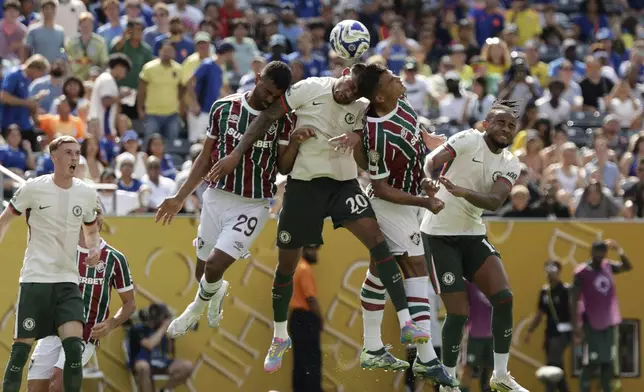 Chelsea's Pedro Joao, left, and Fluminense's Thiago Silva go for a header during the Club World Cup semifinal soccer match between Fluminense and Chelsea in East Rutherford, N.J., Tuesday, July 8, 2025. (AP Photo/Adam Hunger)