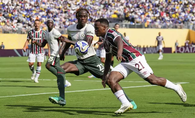 Fluminense's Jhon Arias (21) and Chelsea's Trevoh Chalobah (23) battle for the ball during the Club World Cup semifinal soccer match between Fluminense and Chelsea in East Rutherford, N.J., Tuesday, July 8, 2025. (AP Photo/Seth Wenig)