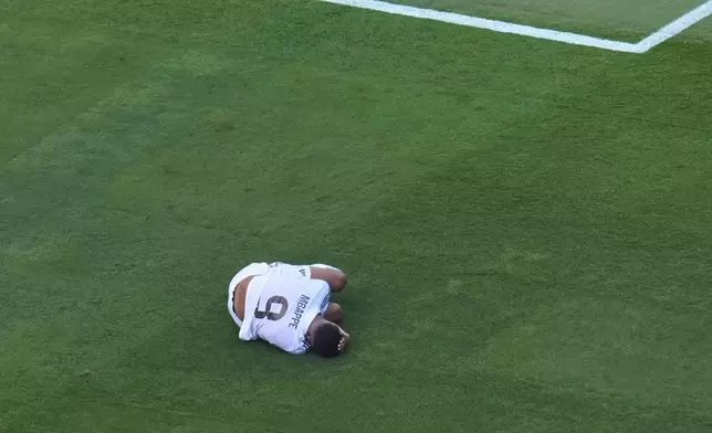 Real Madrid's Kylian Mbappe (9) reacts after a play against Paris Saint-Germain's Joao Neves (87) during the Club World Cup semifinal soccer match between PSG and Real Madrid in East Rutherford, N.J., Wednesday, July 9, 2025. (AP Photo/Pamela Smith)