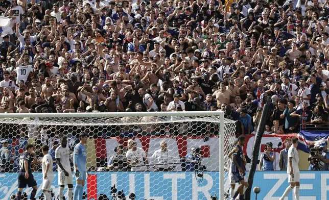 PSG fans cheer their team during the Club World Cup semifinal soccer match between PSG and Real Madrid in East Rutherford, N.J., Wednesday, July 9, 2025. (AP Photo/Adam Hunger)