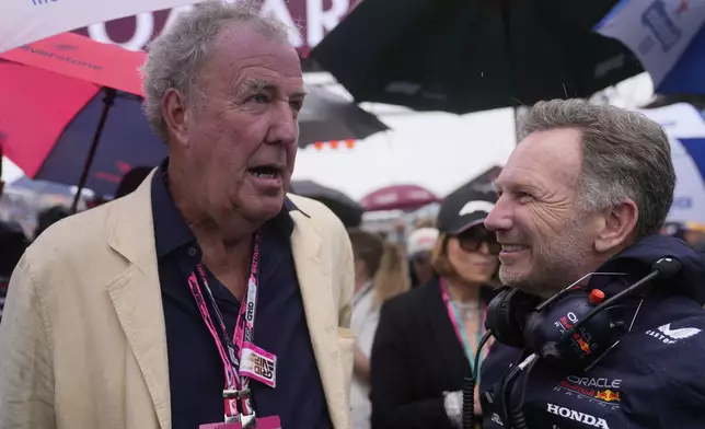 Red Bull team principal Christian Horner, right, speaks TV presenter Jeremy Clarkson before the British Formula One Grand Prix race at the Silverstone racetrack in Silverstone, England, Sunday, July 6, 2025. (AP Photo/Darko Bandic)