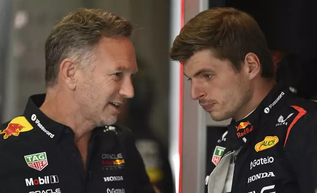 FILE -Red Bull team principal Christian Horner talkks to Red Bull driver Max Verstappen of the Netherlands before the third free practice at the Red Bull Ring racetrack, ahead of the Austrian Formula One Grand Prix in Spielberg, Austria, Saturday, June 28, 2025. (AP Photo/Denes Erdos), File)