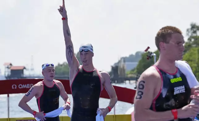 Germany's Florian Wellbrock reacts after winning the men's 10km open water swim at the world swimming championships in Singapore, Wednesday, July 16, 2025. (AP Photo/Vincent Thian)