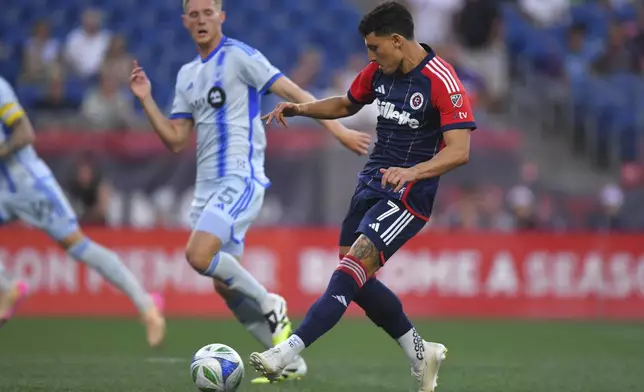 New England Revolution forward Tomás Chancalay (7) kicks the ball into the net to score in front of CF Montréal defender Brandan Craig (5) during the first half of an MLS soccer match, Friday, July 25, 2025, in Foxborough, Mass. (AP Photo/Steven Senne)