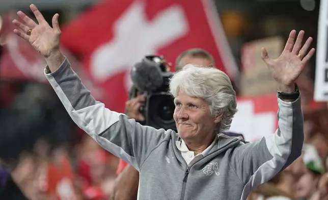Switzerland head coach Pia Sundhage waves supporters at the end of the Women's Euro 2025 quarterfinals soccer match between Spain and Switzerland at Stadion Wankdorf in Bern, Switzerland, Friday, July 18, 2025. (AP Photo/Martin Meissner)