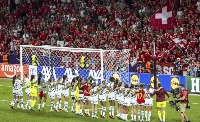 Switzerland's players salute supporters after the Women's Euro 2025 quarterfinals soccer match between Spain and Switzerland at Stadion Wankdorf in Bern, Switzerland, Friday, July 18, 2025. (Michael Buholzer/Keystone via AP)