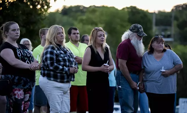 People gather at a vigil for a nine-year-old Montreal girl whose body was found in their community over the weekend, in Ticonderoga, in Essex County, N.Y., Tuesday, July 22, 2025. (Christopher Katsarov/The Canadian Press via AP)