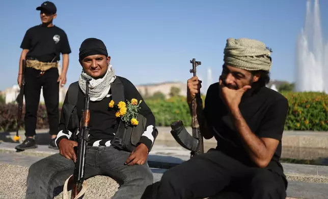 Bedouin fighters from various provinces gather at Umayyad Square in Damascus, Syria, Saturday, July 19, 2025, before heading to the southern province of Sweida to join clashes between Bedouin clans and Druze militias. (AP Photo/Ghaith Alsayed)