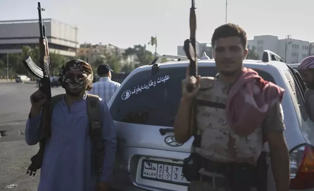 Bedouin fighters from various provinces gather at Umayyad Square in Damascus, Syria, Saturday, July 19, 2025, before heading to the southern province of Sweida to join clashes between Bedouin clans and Druze militias. (AP Photo/Ghaith Alsayed)