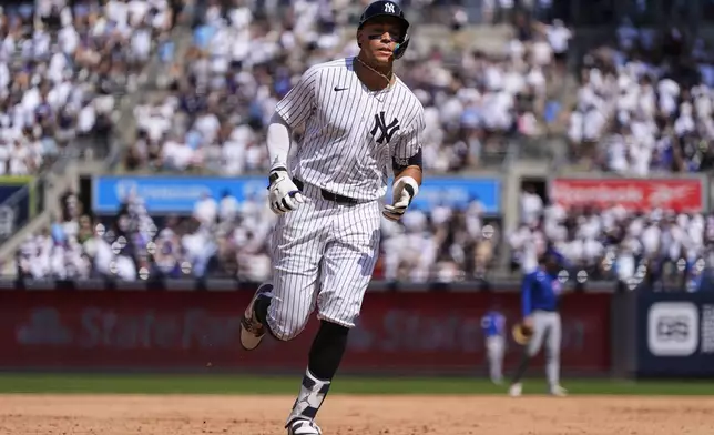 New York Yankees' Aaron Judge (99) runs after hitting a two run home run during the inning of a baseball game against the , Saturday, July 12, 2025, in New York. (AP Photo/Yuki Iwamura)