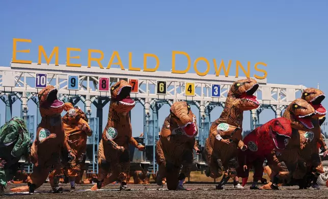 Racers take off during a preliminary heat during the "T-Rex World Championship Races" at Emerald Downs, Sunday, June 29, 2025, in Auburn, Wash. (AP Photo/Lindsey Wasson)