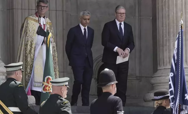 Mayor of London Sadiq Khan, left, and Britain's Prime Minister Keir Starmer depart following a special service at St Paul's Cathedral to mark the anniversary of the terrorist attacks in London July 7, 2005 that killed 52 people, in London, Monday July 7, 2025. (Stefan Rousseau/PA via AP)