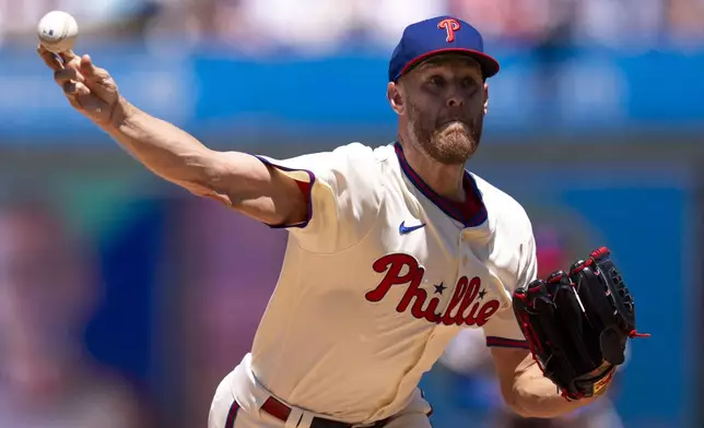 Philadelphia Phillies starting pitcher Zack Wheeler delivers during the first inning of a baseball game against the Cincinnati Reds, Sunday, July 6, 2025, in Philadelphia. (AP Photo/Chris Szagola)
