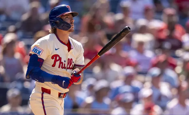 Philadelphia Phillies' Bryson Stott watches his two-run home run during the eighth inning of a baseball game against the Cincinnati Reds, Sunday, July 6, 2025, in Philadelphia. (AP Photo/Chris Szagola)