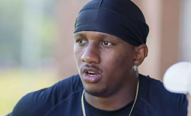 Atlanta Falcons quarterback Michael Penix Jr. (9) speaks to the media at the team’s NFL football training camp, Thursday, July 24, 2025, in Flowery Branch, Ga. (Miguel Martinez/Atlanta Journal-Constitution via AP)