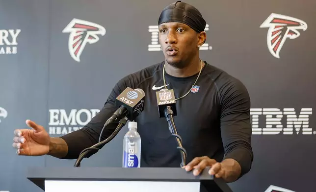 Atlanta Falcons quarterback Michael Penix Jr. (9) speaks to the media at the team’s NFL football training camp, Thursday, July 24, 2025, in Flowery Branch, Ga. (Miguel Martinez/Atlanta Journal-Constitution via AP)