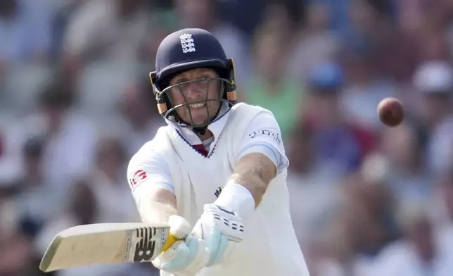 England's Joe Root plays a shot on the third day of the fourth cricket test match between England and India at Emirates Old Trafford, Manchester, England, Friday, July 25, 2025. (AP Photo/Jon Super)