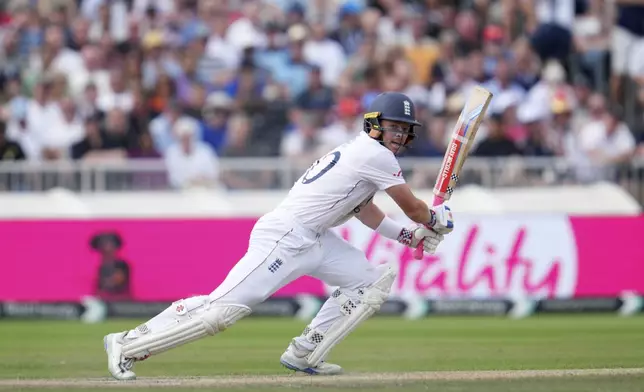 England's Ollie Pope plays a shot on the third day of the fourth cricket test match between England and India at Emirates Old Trafford, Manchester, England, Friday, July 25, 2025. (AP Photo/Jon Super)