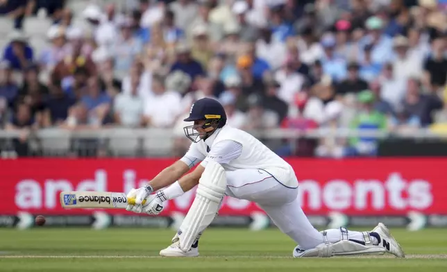 England's Joe Root plays a shot on the third day of the fourth cricket test match between England and India at Emirates Old Trafford, Manchester, England, Friday, July 25, 2025. (AP Photo/Jon Super)