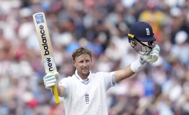 England's Joe Root celebrates after scoring a century on the third day of the fourth cricket test match between England and India at Emirates Old Trafford, Manchester, England, Friday, July 25, 2025. (AP Photo/Jon Super)