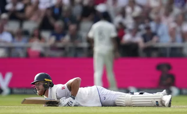 England's captain Ben Stokes loose his balance while playing a shot on the third day of the fourth cricket test match between England and India at Emirates Old Trafford, Manchester, England, Friday, July 25, 2025. (AP Photo/Jon Super)