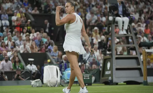 Aryna Sabalenka of Belarus reacts after winning the first set against Emma Raducanu of Britain during a third round women's singles match at the Wimbledon Tennis Championships in London, Friday, July 4, 2025. (AP Photo/Kin Cheung)