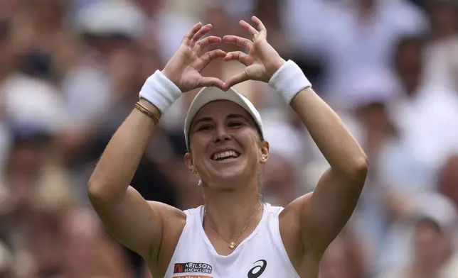 Switzerland's Belinda Bencic celebrates after beating Mirra Andreeva of Russia in a quarterfinal women's singles match between at the Wimbledon Tennis Championships in London, Wednesday, July 9, 2025. (AP Photo/Kin Cheung)