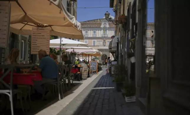 Customers have lunch at restaurants in the town of Castel Gandolfo, a historic summer retreat for popes about 30 kilometers southeast of Rome, where Pope Leo XIV will be spending a short period of rest, as seen Wednesday, July 2, 2025. (AP Photo/Andrew Medichini)