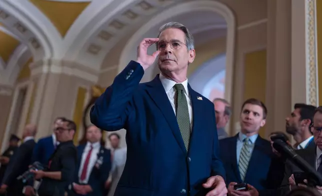 Treasury Secretary Scott Bessent talks to reporters about his lunch meeting with Republican senators and the schedule for getting the Republican megabill to President Donald Trump's desk by July 4, at the Capitol in Washington, Tuesday, June 24, 2025. (AP Photo/J. Scott Applewhite)