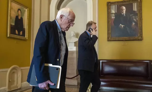 Sen. Bernie Sanders, I-Vt., walks outside the chamber as Republicans begin a final push to advance President Donald Trump's tax breaks and spending cuts package, at the Capitol in Washington, Monday, June 30, 2025. (AP Photo/Manuel Balce Ceneta)