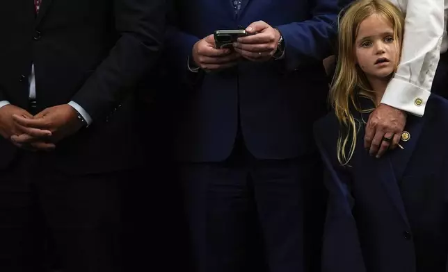 Rep. Zach Nunn, R-Iowa, holds his daughter following the passage of President Donald Trump's signature bill of tax breaks and spending cuts, Thursday, July 3, 2025, at the Capitol in Washington. (AP Photo/Julia Demaree Nikhinson)