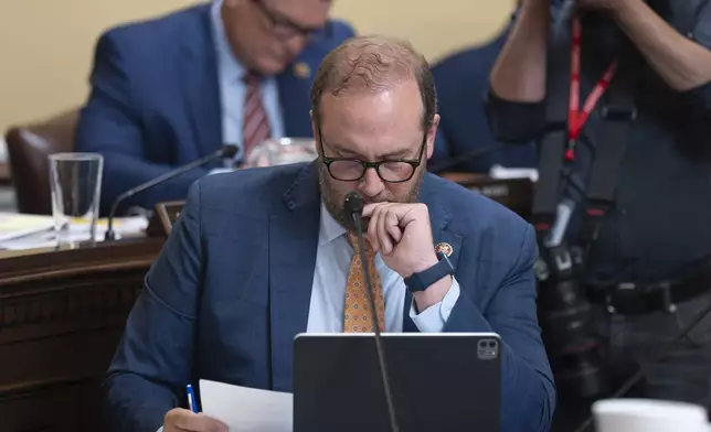 House Ways and Means Committee Chairman Jason Smith, R-Mo., looks over text as the House Rules Committee prepares President Donald Trump's signature bill of big tax breaks and spending cuts to go to the House floor, at the Capitol in Washington, Tuesday, July 1, 2025. (AP Photo/J. Scott Applewhite)