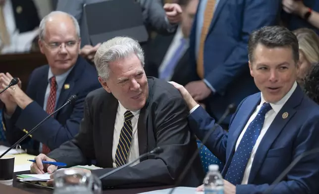 Rep. Frank Pallone, D-N.J., center, the ranking member of the House Energy and Commerce Committee, is flanked by Energy and Commerce Committee chair Brett Guthrie, R-Ky., left, and Rep. Brendan Boyle, D-Pa., the ranking member of the House Budget Committee, as they meet with the House Rules Committee to send President Donald Trump's signature bill of tax breaks and spending cuts to the House floor, at the Capitol in Washington, Tuesday, July 1, 2025. (AP Photo/J. Scott Applewhite)