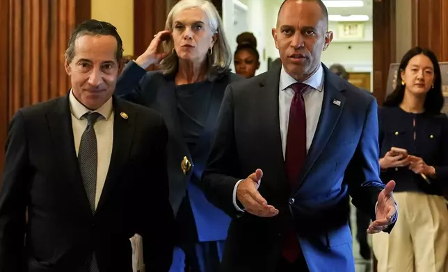 House Minority Leader Hakeem Jeffries, D-N.Y., right, leaves his office with Rep. Jamie Raskin, D-Md., left, and Rep. Katherine Clark, D-Mass., center, shortly after speaking in the House chamber during the final vote for President Donald Trump's signature bill of tax breaks and spending cuts, Thursday, July 3, 2025, at the Capitol in Washington. (AP Photo/Julia Demaree Nikhinson)