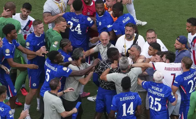 Paris Saint-Germain and Chelsea players scuffle after the Club World Cup final soccer match between Chelsea and PSG in East Rutherford, N.J., Sunday, July 13, 2025. (AP Photo/Matt Slocum)