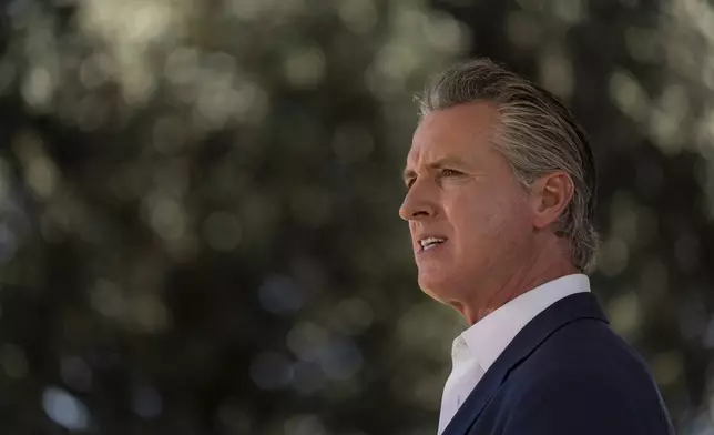 California Gov. Gavin Newsom speaks during a news conference in Downey, Calif., Wednesday, July 16, 2025. (AP Photo/Jae C. Hong)