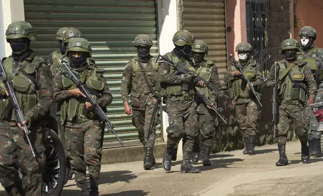 Soldiers patrol during an operation against alleged drug traffickers in La Mesilla, Guatemala, on the border with Mexico, Wednesday, July 30, 2025. (AP Photo/Moises Castillo)