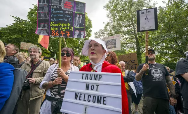 People take part in a Stop Trump Scotland protest outside the US Consulate in Edinburgh, as President Donald Trump begins his five-day private trip to the country at his Turnberry golf course in South Ayrshire on Saturday July 26, 2025. (Jane Barlow /PA via AP)