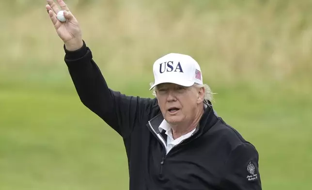 President Donald Trump waves as he plays golf at the Trump Turnberry golf course in Turnberry, Scotland, Sunday, July 27, 2025.(AP Photo/Alastair Grant)
