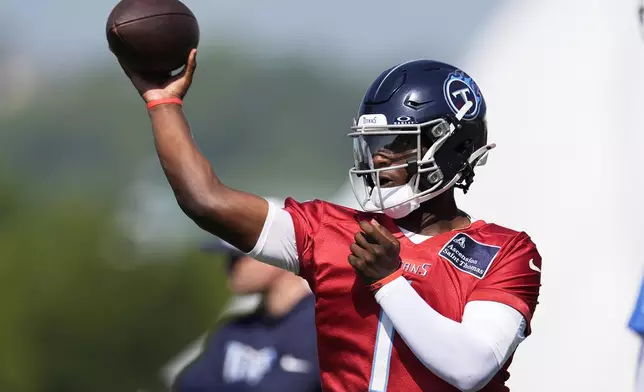 Tennessee Titans quarterback Cam Ward (1) looks to throw a pass during practice at the team's NFL football training camp Wednesday, July 23, 2025, in Nashville, Tenn. (AP Photo/George Walker IV)