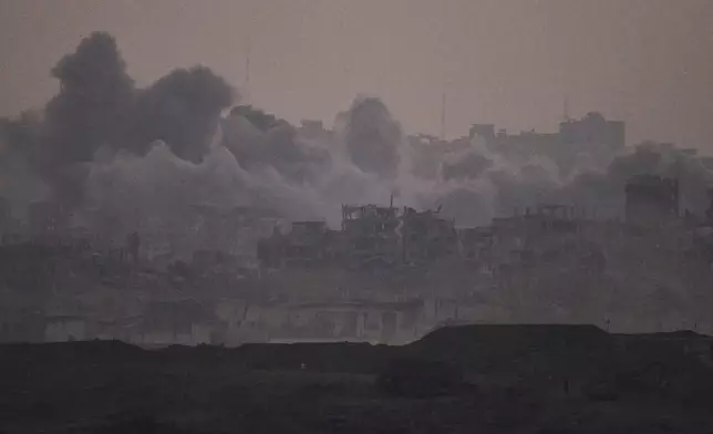 Smoke rises after an explosion during Israeli air and ground operations in the Gaza Strip as seen from southern Israel, Tuesday, July 22, 2025. (AP Photo/Leo Correa)
