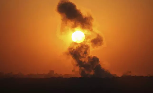 Smoke billows from an explosion in the northern Gaza Strip, as seen from southern Israel Wednesday, July 23, 2025. (AP Photo/Ohad Zwigenberg)