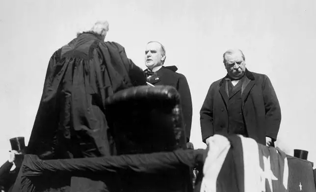 FILE - Chief Justice Melville Weston Fuller administers the oath of office to President-elect William McKinley during his inauguration in Washington, March 4, 1897, as outgoing President Grover Cleveland stands behind McKinley. (Library of Congress via AP File)