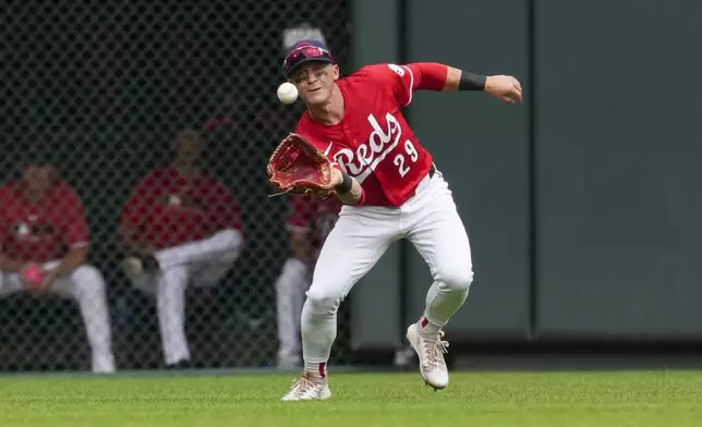 Cincinnati Reds outfielder TJ Friedl catches a line drive hit by Tampa Bay Rays' Chandler Simpson during the seventh inning of a baseball game, Sunday, July 27, 2025, in Cincinnati. (AP Photo/Jeff Dean)