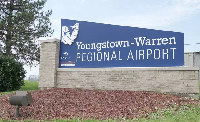 A sign for the Youngstown -Warren Regional Airport is pictured in Vienna, Ohio, Monday, June 30, 2025, where a day earlier a plane crashed on take off killing all onboard. (AP Photo/Sue Ogrocki)