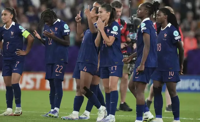 France players react during a penalty shootout at the end of the Women's Euro 2025 quarterfinals soccer match between France and Germany at St. Jakob-Park in Basel, Switzerland, Saturday, July 19, 2025. (AP Photo/Alessandra Tarantino)
