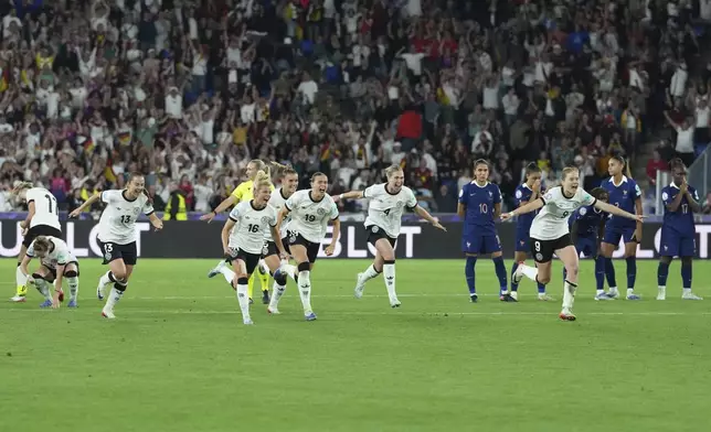 Players of Germany run to celebrate after winning the Women's Euro 2025 quarterfinals soccer match between France and Germany at St. Jakob-Park in Basel, Switzerland, Saturday, July 19, 2025. (AP Photo/Martin Meissner)
